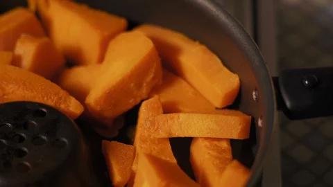 Macro, Slices of Pumpkin Cooked in the Pan Stock Footage 99554482