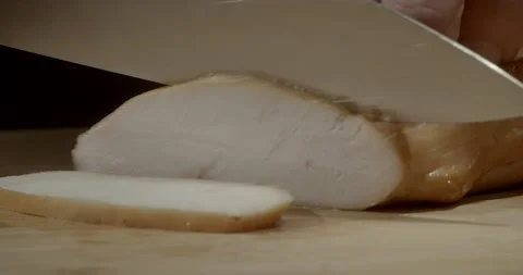 Macro of slicing brisket with a knife. Hands are slicing chicken breast, ham at 스톡 동영상 221124568