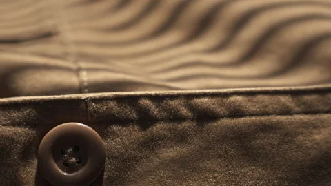 Macro Slide Shot of Premium Brown Suede Coat Fabric Texture Detail with Button Stock Footage 337764424