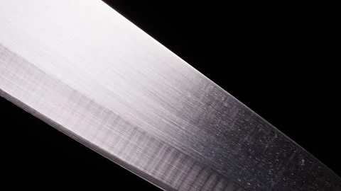 Macro Slider Along a Clean Kitchen Knife Blade Against a Black Background. Sharp Stock Footage 337498562