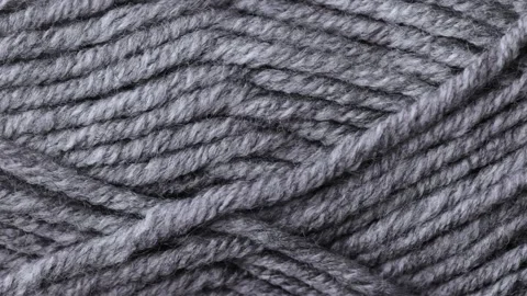 Macro slider shot of a single thick gray wool skein with soft texture Stock Footage 322709588