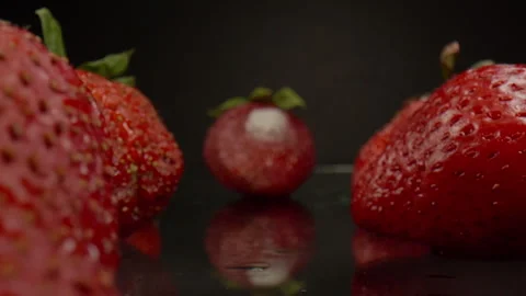 Macro slider shot through rotten strawberries Video stock 242470284