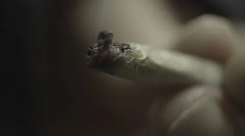 A macro slow motion clip of a light joint of Cannabis Vídeo Stock 37268916