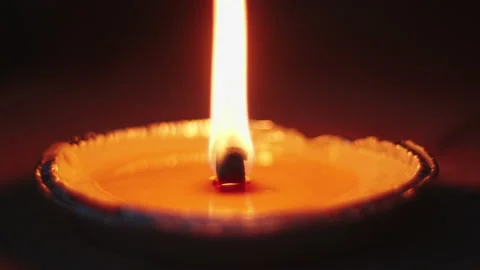 Macro slow motion of fire burning citronella candle in summer Stock Footage 136929014