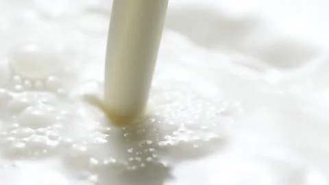 Macro slow motion pouring white milk, closeup splashing fresh drink with bubbles Stock-Footage 214216516