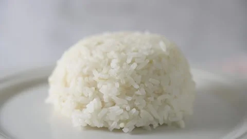 Macro slow motion shot of plated jasmine rice Stock Footage 160564431