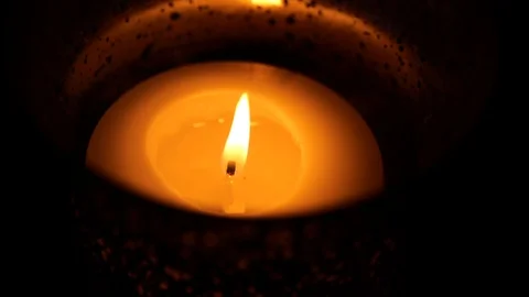 Macro slow motion single candle glowing orange Stock-Footage 112767858