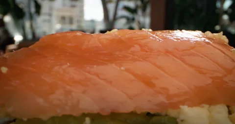 Macro slow-motion video of a chef preparing a salmon sandwich. Stock Footage 257069771