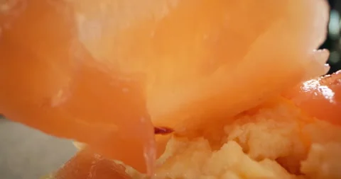 Macro slow motion video of placing a piece of salmon on a sandwich Stock-Footage 259617608