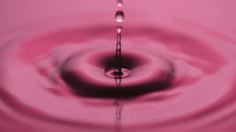 Macro slow motion water drop pink Stock Footage 158500485