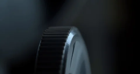 Macro slowly turning a focus wheel on a microscope white male Stock Footage 110684558