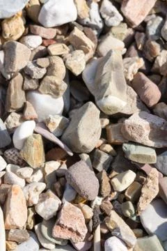 Macro small rocks on the beach background image Stock Photos