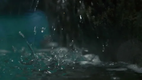 Macro of a small waterfall in slow motion Stockbeeldmateriaal 136656002