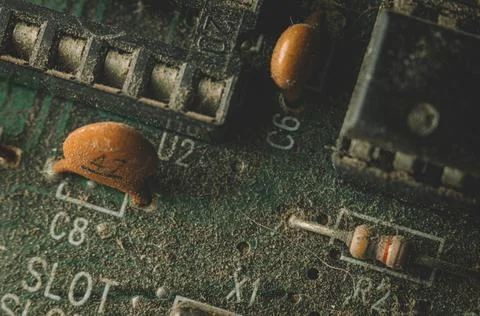 Macro snapshot of an old pcb computer. Lots of dust, letters and numbers. Stock Photos