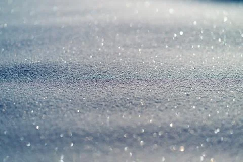 Macro snow crystal texture under sunlight, tiny reflective facets forming glitte 스톡 사진