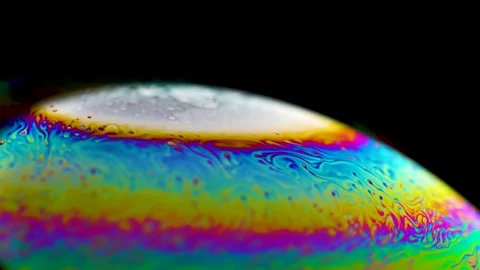 Macro soap bubble creates a colorful and psychedelic background. Rainbow colors Stock-Footage 150564823