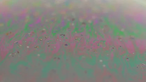 Macro soap bubble creates a colorful and psychedelic background. Rainbow colors Video stock 150564900