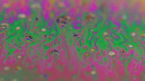 Macro soap bubble creates a colorful and psychedelic background. Rainbow colors 스톡 동영상 150565032