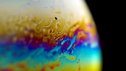 Macro soap bubble creates a colorful and psychedelic background. Rainbow colors 스톡 동영상 150565125