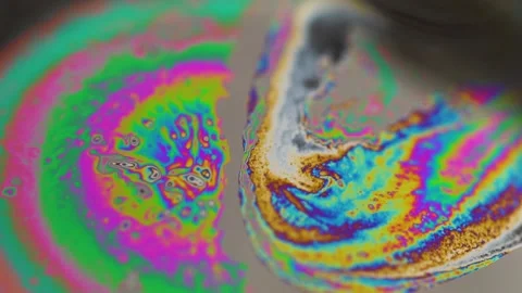Macro soap bubble creates a colorful and psychedelic background. Rainbow colors Stock Footage 150565129