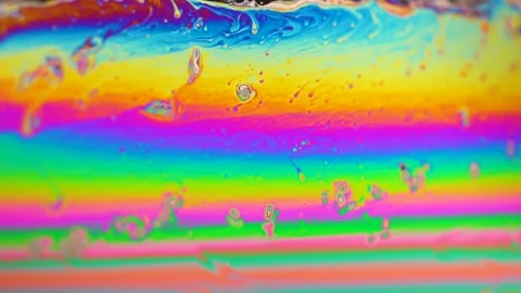 Macro soap bubble creates a colorful and psychedelic background. Rainbow colors Video stock 150565941