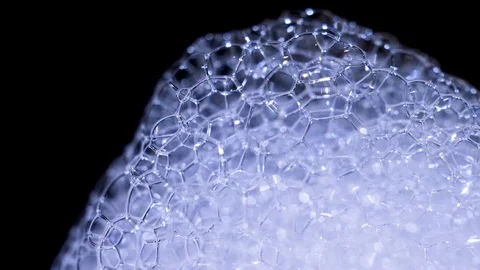 Macro Soap WhiteFoam Popping Bubbles Black Background Video stock 127920721