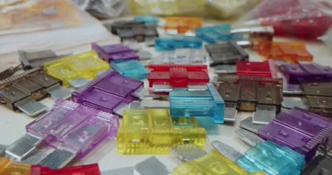 Macro Soft focus. Close-up. Hand Picking a Red Automotive Blade Fuse from a Stock-Footage 311203822