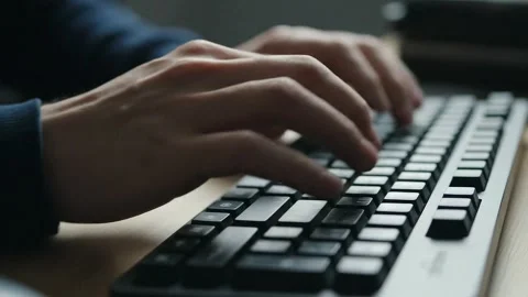 Macro Soft Focus Shot of Man Typing on Keyboard Stock Footage 314805449