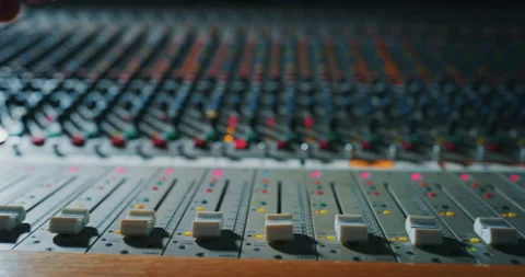 Macro of sound producer hand using music mixer in recording studio. Stock Footage 141292510