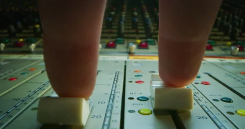 Macro of sound producer hand using music mixer in recording studio. Stock Footage 141292743