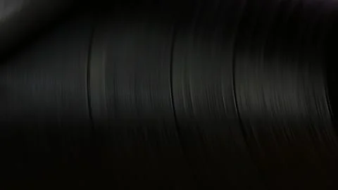 Macro spinning black disc. Moving strips retro background. Stock Footage 135712199