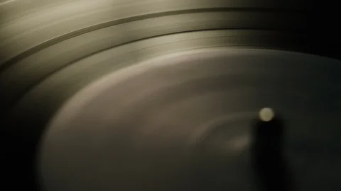Macro of spinning vinyl record on turntable Stock Footage 129572093