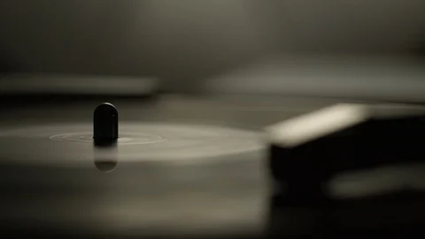 Macro of spinning vinyl record on turntable Stock Footage 129572319