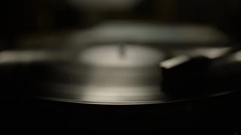 Macro of spinning vinyl record on turntable Stock Footage 129586848