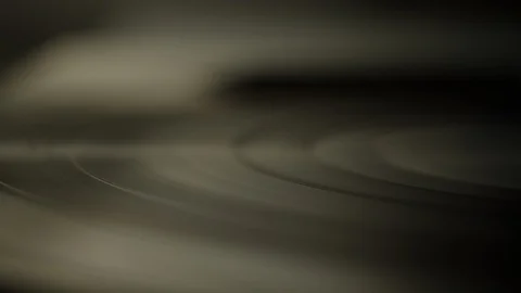 Macro of spinning vinyl record on turntable Stock Footage 129587033