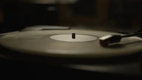 Macro of spinning vinyl record on turntable Stock Footage 129587272