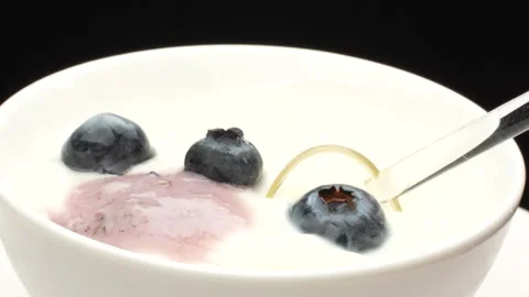 Macro Spoon Scooping Blueberry and White Yogurt from Bowl 4K Stock Footage 320662093