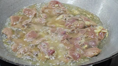 Macro stir-fried sliced pork liver with steam in wok. Stock Footage 342028371