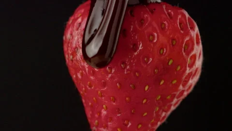 Macro strawberry chocolate drip slow motion liquid cocoa delicious food lust Stock Footage 274306839