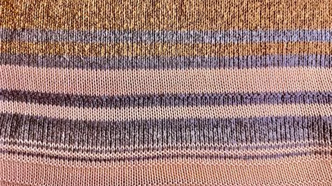 Macro striped knit textile background showcases earth tone ochre and lavender Stock Photos