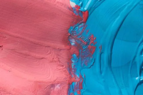 Macro study of deep blue and crimson red paint interaction Stock Photos