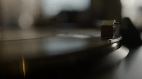 Macro of stylus needle on spinning vinyl record Stock Footage 129573785