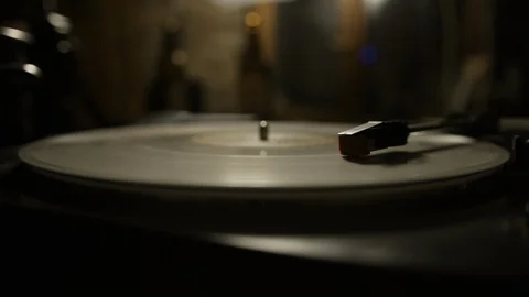 Macro of stylus needle on spinning vinyl record Stock Footage 129587147