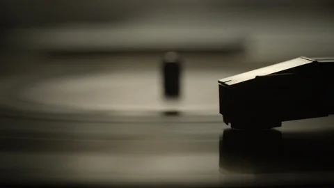 Macro of stylus needle on spinning vinyl record Stock Footage 129587953