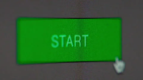 Macro super close up. Clicking a green Start button on a computer. 4 clips. Stock Footage 288969848
