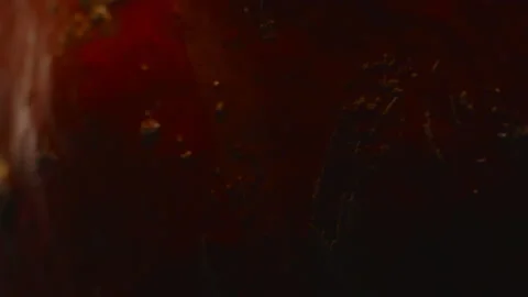 Macro, the surface of a red pumpkin in a turning motion on a dark background Stock Footage 185647401