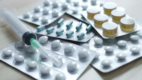 Macro Syringe and Tablets, Rotate. Medicines, Medicines, Vitamins, Antibiotics,  Stock Footage 151099063