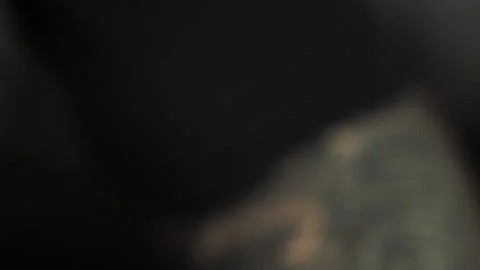 Macro tattoo master with beard and brown eyes creates tattoo Stockbeeldmateriaal 104863987