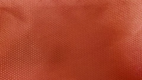 Macro terracotta polyester mesh fabric texture features detailed weave patter Foto stock