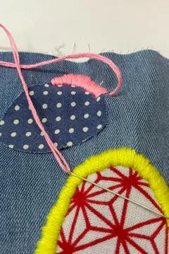 Macro textile composition with colorful stitching. Foto stock
